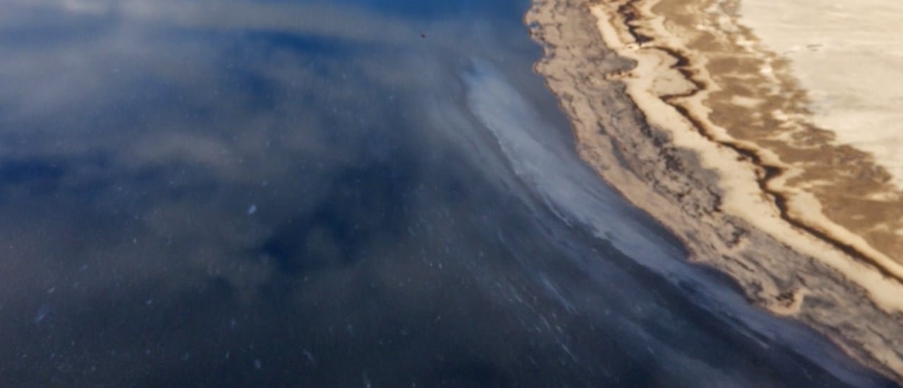 default-738 Water is shown with what appears slicks of hydrocarbons.